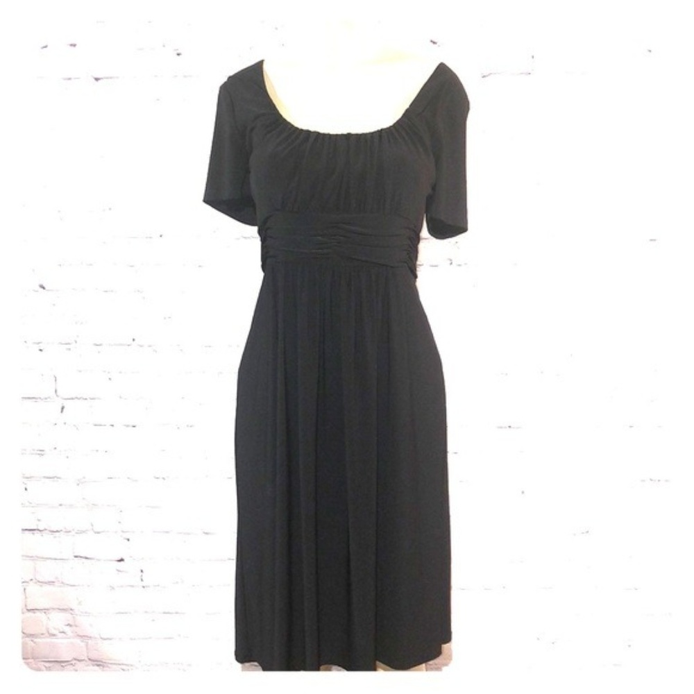 Black short sleeve dress with a flare waist